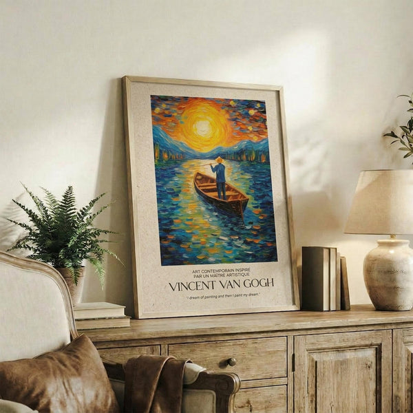 May include: Framed Van Gogh-inspired poster featuring a figure in a wooden boat on swirling blue water under a dramatic yellow sun and colorful sky, displayed on a rustic wooden sideboard alongside a fern plant, books, ceramic vase, and lamp in a cozy living room setting with neutral tones and natural lighting.