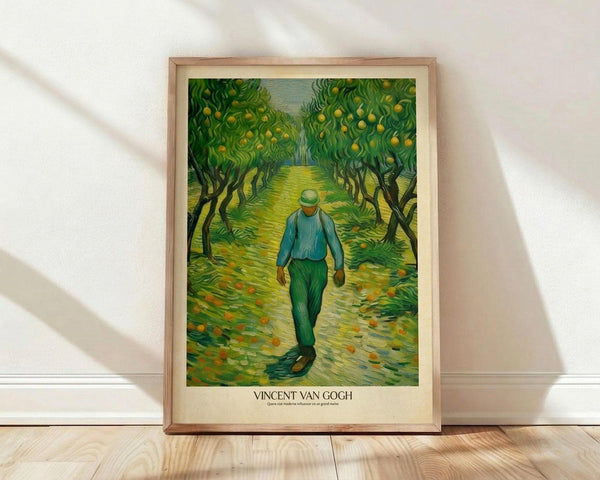 May include: Framed poster print of Van Gogh-style artwork showing a figure in blue shirt and green pants walking down a tree-lined path through an orchard with yellow fruit. The painting features characteristic swirling brushstrokes in vibrant greens and yellows. Light wood frame sits against white textured wall on wooden floor with natural lighting creating diagonal shadows across the scene.