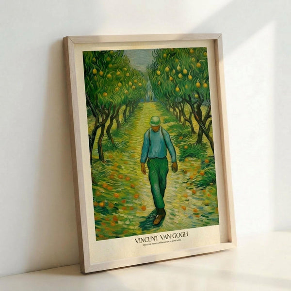 May include: Framed art print showing a figure in blue shirt and green pants walking down a tree-lined path with yellow fruit trees on either side. The painting features Van Gogh's distinctive swirling brushstroke style in vibrant greens and yellows. Light wood frame displayed against white wall, leaning at an angle with natural lighting creating soft shadows.