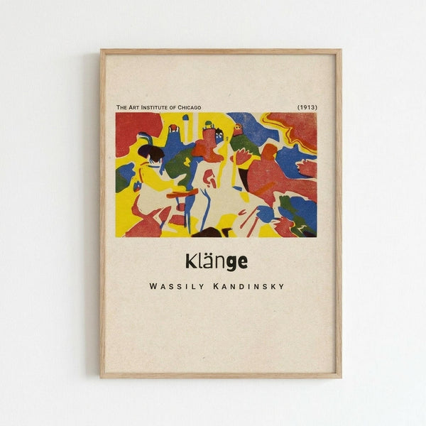 May include: Framed art print hanging on white wall showing Kandinsky's abstract expressionist artwork with vibrant colors including red, yellow, blue, and green organic shapes. Features cream matting around colorful abstract composition with text below reading "Klänge" and "Wassily Kandinsky" along with "The Art Institute of Chicago (1913)". Light wood frame against minimal white background.
