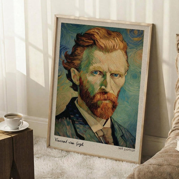 May include: Framed art print of Van Gogh's self-portrait featuring his distinctive red beard, blue eyes, and swirling brushstroke style in blues and greens, displayed leaning against white wall corner on white textured rug next to wooden side table with white coffee cup and saucer, natural window light creating soft shadows.