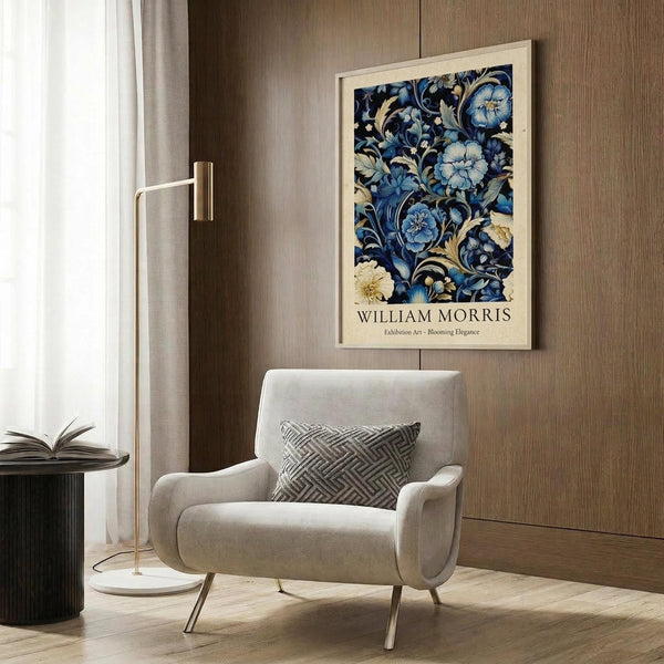 May include: Framed William Morris floral art print with blue flowers and cream botanical motifs hanging on wood paneled wall above beige upholstered armchair with geometric patterned pillow, gold floor lamp, and dark round side table with open book in modern living room setting