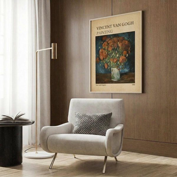 May include: Vincent van Gogh poster print showing orange poppies in a white vase against blue background, displayed in modern living room with beige armchair, geometric pillow, brass floor lamp, and wood paneled wall
