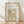 May include: Framed botanical poster with William Morris Garden Tulip design from 1885 Birmingham, featuring delicate orange tulips on intricate olive green damask pattern background, displayed in light wood frame against white wall on wooden floor with natural window lighting creating soft shadows