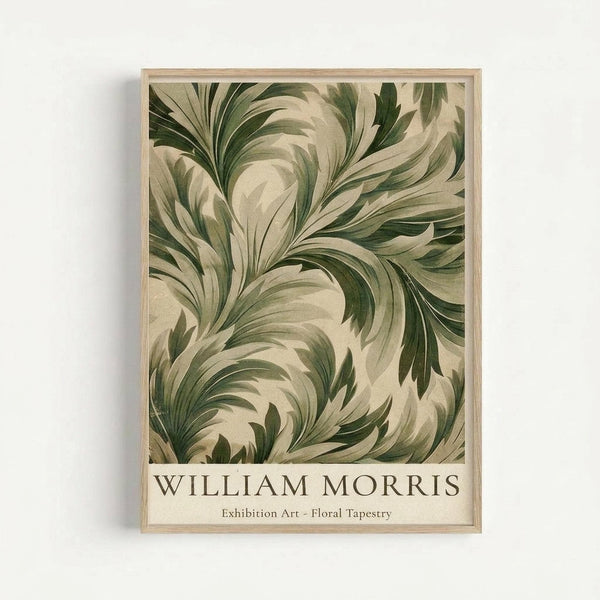 May include: Framed botanical art print hanging on white wall featuring flowing, swirling acanthus leaves in sage green and cream tones. The ornate Victorian-style foliage pattern fills most of the vertical poster, with "WILLIAM MORRIS" and "Exhibition Art - Floral Tapestry" text at bottom. Natural wood frame complements the earthy, decorative Arts and Crafts movement design with its organic, flowing leaf motifs.