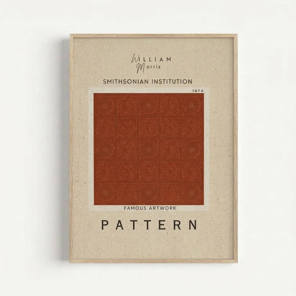 Framed art print featuring a rust-colored William Morris pattern with repeating circular floral motifs arranged in a grid. The artwork is displayed on cream textured paper with "SMITHSONIAN INSTITUTION 1870" and "FAMOUS ARTWORK PATTERN" text above and below the design. Natural wood frame against white wall background.