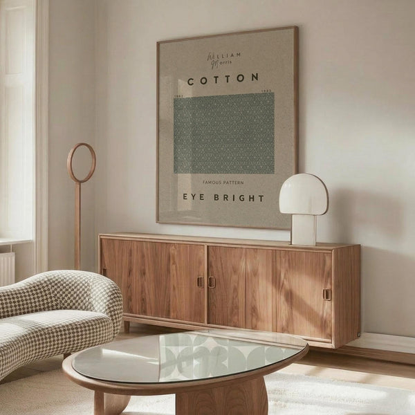 May include: Beige and sage green vintage-style botanical poster displayed above wooden sideboard in minimalist living room with houndstooth chair, glass coffee table, and modern white mushroom lamp. Natural lighting creates warm shadows on cream walls.