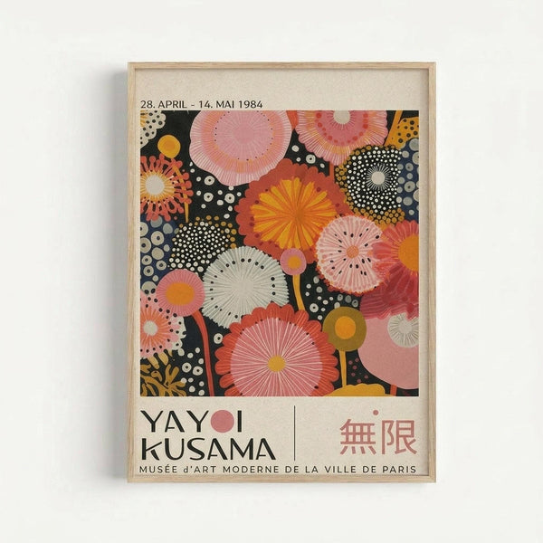 Framed exhibition poster featuring vibrant circular and radial patterns in pink, orange, yellow, and white against a dark polka-dotted background. The artwork displays organic, flower-like forms with radiating lines and dots. Text shows dates "28. APRIL - 14. MAI 1984" at top, "YAYOI KUSAMA" in large black letters, Japanese characters, and "MUSÉE D'ART MODERNE DE LA VILLE DE PARIS" at bottom. Light wooden frame against white wall background.