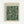 Vintage-style poster with cream background featuring William Morris text at top and intricate dark green floral pattern with cream colored flowers and flowing leaves. Quote at bottom reads "You can't have art without resistance in the materials." Natural wood frame against white wall background.