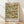 May include: Framed botanical poster leaning against white wall on light wood floor. Features William Morris's Trellis pattern with blue birds perched among climbing rose vines, orange-red blooms, and green foliage arranged in grid-like trellis design on cream background. Natural wood frame with soft window light casting shadows across white textile surface.