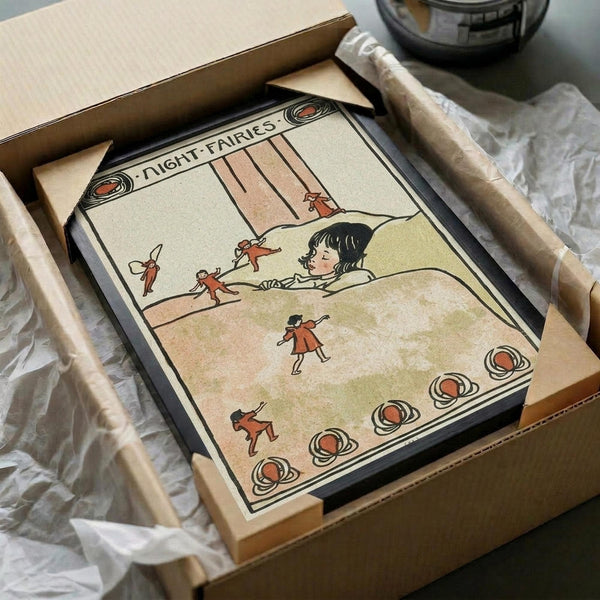 May include: Vintage 1910 illustration print in wooden frame showing child in bed watching small red-clothed fairies dancing around the room. Art features muted earth tones with decorative circular border elements. Frame sits in cardboard shipping box with tissue paper wrapping on white surface next to wooden dowels and glass vessel.