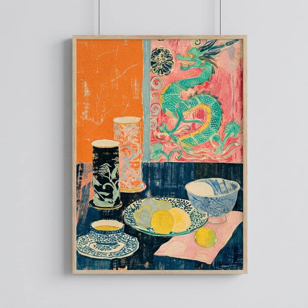 May include: Framed vintage-style still life print hanging on white wall, featuring colorful Asian-inspired artwork with green dragon motif, ceramic vases, bowls with fruit, and decorative objects arranged in quadrant composition with orange, pink, and navy blue color blocks