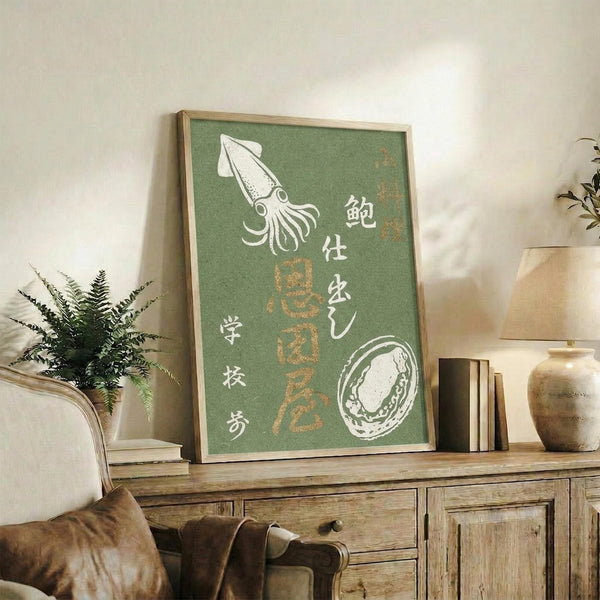 May include: Framed green poster with vintage Japanese seafood illustrations including white squid and abalone shell, displayed on rustic wooden sideboard in modern living room with leather armchair, fern plant, ceramic vases and books