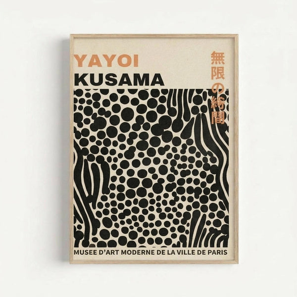 A framed exhibition poster featuring black polka dots of varying sizes on a cream background, with flowing black lines creating an organic pattern. Orange text reads "YAYOI KUSAMA" at the top, with Japanese characters in the upper right corner. Black text at the bottom reads "MUSEE D'ART MODERNE DE LA VILLE DE PARIS." The poster is displayed in a light wood frame against a white wall, showing the distinctive dot and infinity net motifs characteristic of Kusama's artistic style.
