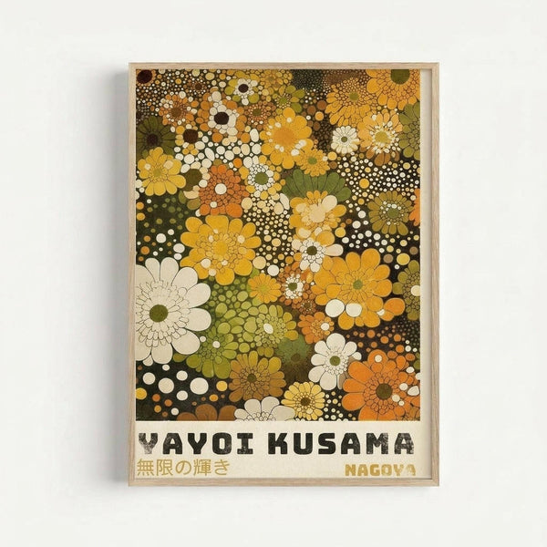 Framed art print featuring a dense pattern of stylized flowers and polka dots in warm autumn colors including yellows, oranges, greens, browns, and cream. The abstract floral design fills the entire composition with overlapping daisy-like blooms of varying sizes interspersed with circular dots and geometric patterns. Text at bottom reads "YAYOI KUSAMA" with Japanese characters and "NAGOYA" in a simple font. Displayed in a light wood frame against a white wall.