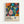 Colorful abstract art poster in light wood frame featuring vibrant floral and organic shapes with polka dot patterns on black background. Artwork displays blues, oranges, pinks, yellows, and greens in a contemporary botanical style. Text below includes "YAYOI KUSAMA" and Japanese characters, along with "MUSÉE d'ART MODERNE DE LA VILLE DE PARIS" in smaller print on cream-colored bottom section.