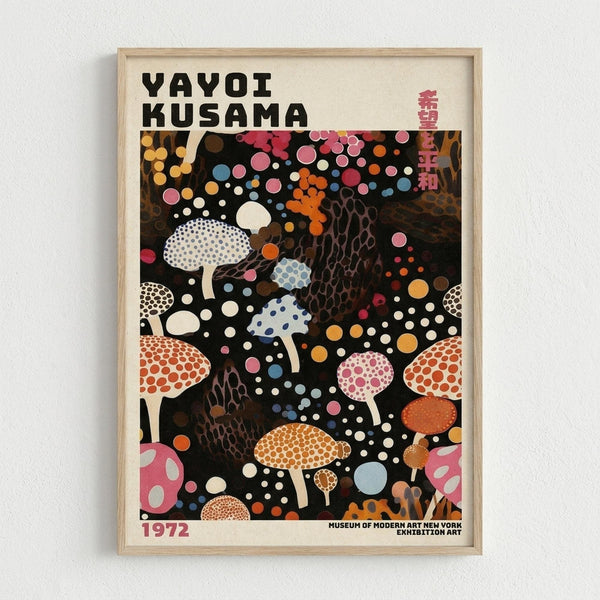 A framed art poster featuring Yayoi Kusama's signature polka dot style with colorful mushrooms and organic forms on a black background. The artwork displays various spotted mushrooms in pink, orange, blue, and white, interspersed with circular dots and abstract shapes. Text reads "YAYOI KUSAMA" at the top, "1972" at bottom left, and "MUSEUM OF MODERN ART NEW YORK EXHIBITION ART" at bottom right, with Japanese characters on the upper right. The poster has a light wood frame