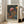 May include: Framed art print featuring colorful psychedelic mushrooms in various sizes against a dark starry background with floating dots and organic flowing elements. The artwork displays vibrant oranges, blues, and pinks in a whimsical fantasy style. Japanese text appears at the bottom. The light wood frame leans against a white wall next to a beige sofa in a bright living room with large windows.