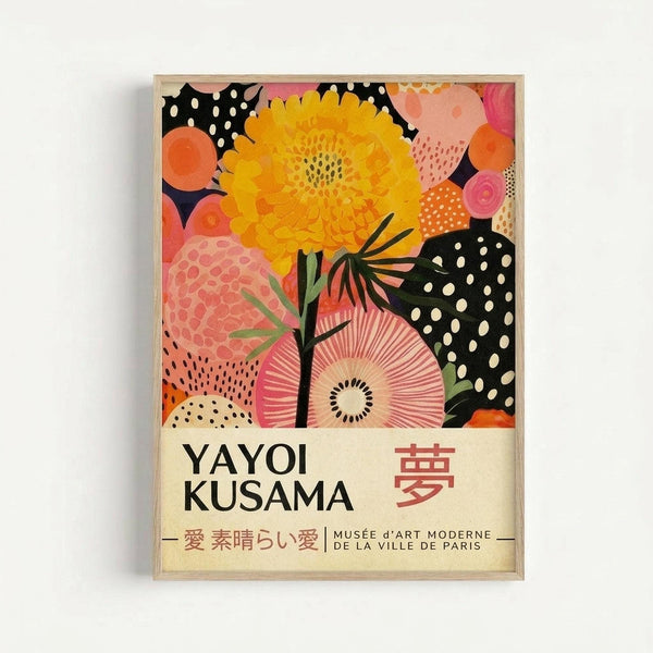 Colorful abstract floral artwork featuring a large yellow flower, pink circular blooms, and black polka-dotted shapes against a vibrant background. The print displays "YAYOI KUSAMA" and Japanese characters with "MUSÉE d'ART MODERNE DE LA VILLE DE PARIS" text at bottom. Framed in light wood and mounted on a white wall.