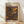 May include: Framed poster with abstract polka dot artwork in vibrant colors including orange, purple, yellow, and pink circles of varying sizes scattered across a dark background. The wooden frame sits against white walls on light wood flooring with natural sunlight casting diagonal shadows across the scene.