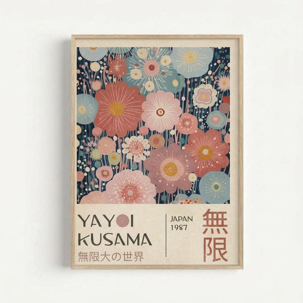May include: Framed poster with stylized floral pattern in coral, pink, and blue tones against dark navy background, featuring radiating sunburst and circular flower motifs. Text reads "YAYOI KUSAMA" with "JAPAN 1987" and Japanese characters below. Light wood frame mounted on white wall with subtle shadow.