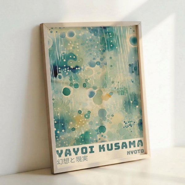 May include: Framed art print with abstract aqua and teal watercolor background featuring scattered circles and dots in various sizes, vertical dripping lines, and Japanese text at bottom. Light wooden frame leaning against white wall on light surface.