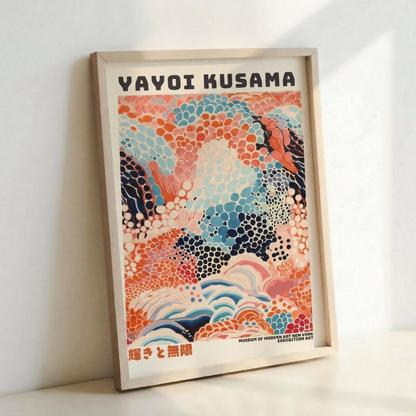 May include: Framed art print in light wood frame leaning against white wall. Poster features abstract artwork with colorful dot patterns in coral, turquoise, navy and cream tones, resembling organic cellular forms. Text at top reads "YAYOI KUSAMA" with Japanese characters at bottom and small Museum of Modern Art New York text. Vibrant contemporary art style with flowing, bubble-like textures throughout composition.