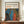 May include: Framed art print featuring Yayoi Kusama's distinctive polka dot style with flowing blue and red organic shapes against black background filled with white, orange and yellow dots. The poster displays "YAYOI KUSAMA" at top with Japanese characters and "JAPAN 1987" text. Wooden frame sits on light wood console table beside white ceramic vase and stacked books against cream wall with white molding.