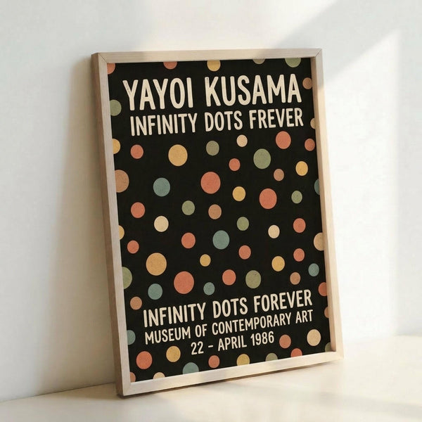 A black poster with colorful polka dots in coral, yellow, sage green, and cream scattered across the surface. White text reads "YAYOI KUSAMA INFINITY DOTS FREVER" at the top and "INFINITY DOTS FOREVER MUSEUM OF CONTEMPORARY ART 22 - APRIL 1986" at the bottom. The print is displayed in a light wood frame leaning against a white wall, showing the poster's full design and minimal modern aesthetic.