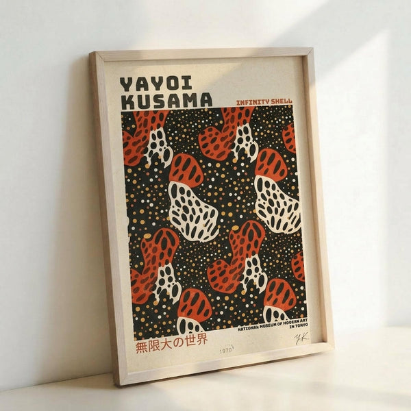 May include: Framed art print in light wood frame leaning against white wall. Features abstract pattern of red and white polka-dotted organic shapes resembling mushrooms or shells on black dotted background. Text reads "YAYOI KUSAMA" and "INFINITY SHELL" at top, Japanese characters and "1970" at bottom. Vintage exhibition poster style with cream-colored paper background.
