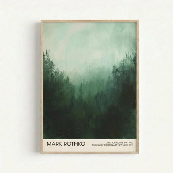 May include: Framed poster print hanging on white wall featuring misty forest landscape in green tones with evergreen trees silhouetted against foggy sky. Light wood frame surrounds artwork with white border at bottom containing black text reading "MARK ROTHKO" and exhibition details. Atmospheric, painterly style with gradient from light mint green sky to deep forest green at bottom.