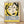 May include: Framed vintage exhibition poster featuring abstract portrait of woman with black hair against yellow background, displayed on white textured wall above light wood flooring. French text in blue letters advertises Matisse artwork including paintings, drawings, and sculptures. Natural wood frame complements minimal interior setting with soft shadows.