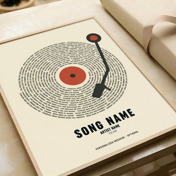 May include: Framed vintage-style poster featuring a cream vinyl record design with red center label and black tonearm. Text spirals in concentric circles around the record, with song title, artist name, and year placeholders below. Print displayed in light wood frame on cream surface with soft natural lighting and neutral background.