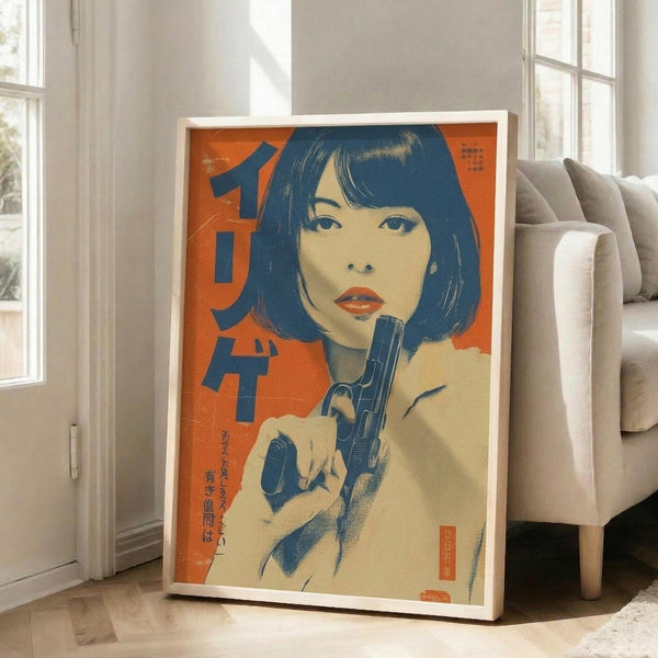 May include: Large framed poster leaning against white wall next to beige sofa in bright living room with hardwood floors and large windows. The vintage-style artwork features a woman with dark bob haircut and red lips holding a handgun, rendered in orange, blue and cream colors with Japanese text, displayed in white frame.