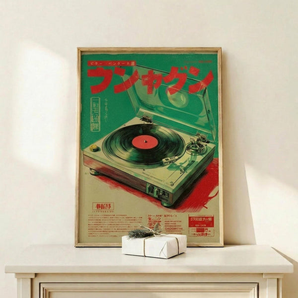 May include: Vintage Japanese advertisement poster featuring a turntable with red vinyl record, displayed in wooden frame on light wood shelf against white wall. Green and red retro design with Japanese text. Small wrapped gift box with dark ribbon sits nearby. Poster shows detailed turntable illustration in mint green and cream tones with technical specifications below.