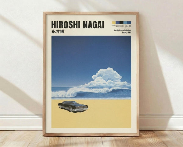 May include: Framed poster print leaning against white wall on wooden floor. Features retro-style artwork with blue sky, white puffy cloud, ocean waves, and dark vintage car on sandy beach. Japanese text at top. Light wood frame with cream matting. Natural lighting creates soft shadows on textured white wall.