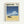 Framed poster featuring a minimalist illustration of a dark sedan car parked on golden sand beach. Above, white-capped ocean waves roll beneath a bright blue sky with puffy white clouds. The image has a dreamy, nostalgic quality with clean lines and vibrant colors. Text at top reads "HIROSHI NAGAI" with Japanese characters below, plus "Pacific Breeze Collection Tokyo, 1982" in upper right corner. Light wood frame against white wall.