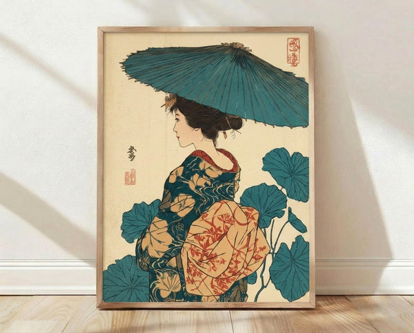 May include: Framed Japanese woodblock print artwork displayed on wooden floor against white wall. Features woman in traditional kimono with floral patterns in teal, coral and cream colors, holding blue paper umbrella. Surrounded by large teal lotus leaves. Art style shows classic ukiyo-e technique with delicate linework and muted color palette on cream background. Natural wood frame complements the organic tones of the vintage-inspired Asian art.