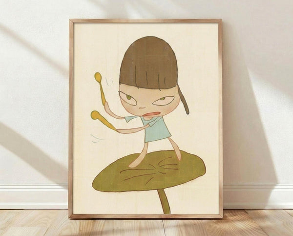 May include: Framed art print showing a cute cartoon child with brown bob haircut and green eyes, wearing light blue top, standing on large green mushroom while holding drumsticks with arms raised. Minimalist illustration in soft earth tones on cream background, displayed in thin wooden frame against white textured wall on light wood floor.