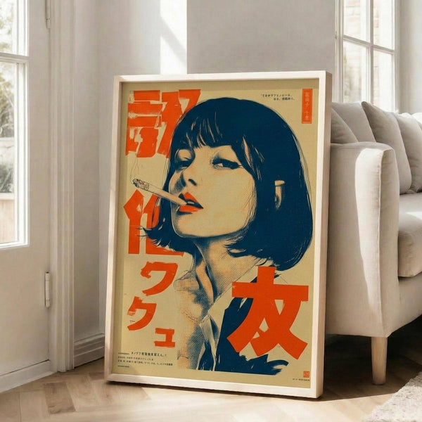 May include: A framed vintage-style Japanese poster featuring a woman with dark bob haircut and bangs smoking a cigarette, rendered in retro comic book style with bold orange and blue colors on cream background. The artwork includes Japanese text characters and is displayed in a white frame leaning against a wall next to a beige sofa in a bright, minimalist living room with white walls and large windows.