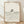 May include: Framed minimalist line art poster showing a woman with long hair submerged in flowing wavy water lines, displayed in light wood frame against cream textured wall with soft natural lighting and shadows on wooden floor