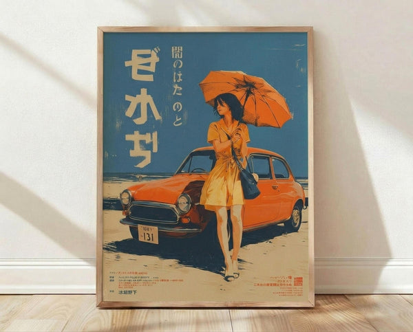 May include: Vintage Japanese poster print in wooden frame leaning against white wall on light wood floor. Blue sky background with orange classic car parked on sandy beach. Woman in flowing orange dress holds matching parasol, standing beside vehicle with license plate. Large Japanese text characters on left side, smaller text at bottom. Warm orange and blue color palette creates retro 1970s aesthetic.