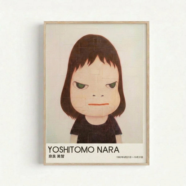Framed poster displaying a stylized illustration of a young girl with shoulder-length brown hair and green eyes, wearing a black shirt. The character has a sullen expression with a small orange mouth. Below the artwork is text reading "YOSHITOMO NARA" in black letters, followed by Japanese characters and dates "1992年8月31日～10月31日". The poster has a light wooden frame and is mounted on a white wall.