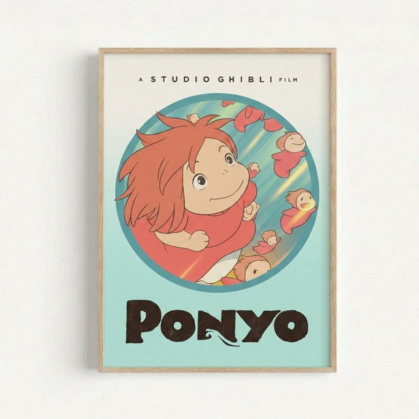 Framed poster print featuring the red-haired protagonist Ponyo from Studio Ghibli's animated film. The character is shown in a circular blue bubble surrounded by smaller fish-like creatures, all rendered in the distinctive Studio Ghibli art style with warm coral and teal colors. The movie title "PONYO" appears in large brown letters below the circular illustration, with "A STUDIO GHIBLI FILM" text at the top. The print has a light wooden frame and sits against a white wall.