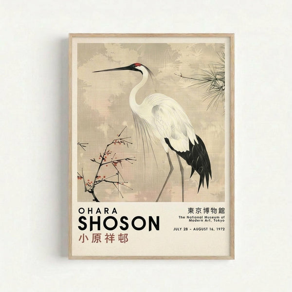 Framed vintage Japanese art print featuring a white crane with black wing tips and a red crown, standing among delicate flowering branches and pine needles against a muted beige background. The artwork includes exhibition text reading "OHARA SHOSON" with Japanese characters and "The National Museum of Modern Art, Tokyo JULY 28 - AUGUST 16, 1972." The print is displayed in a light wooden frame mounted on a white wall.