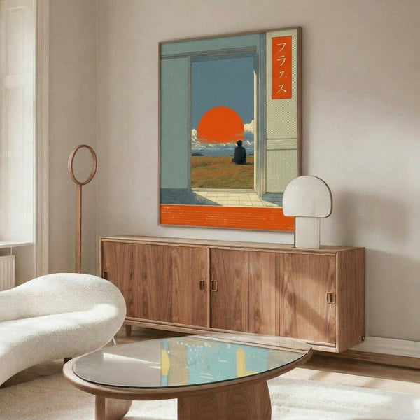 May include: Japanese-inspired poster with orange sun, figure by water, and Japanese text, displayed above wooden credenza in modern living room with white sculptural chair, brass floor lamp, glass coffee table, and neutral walls