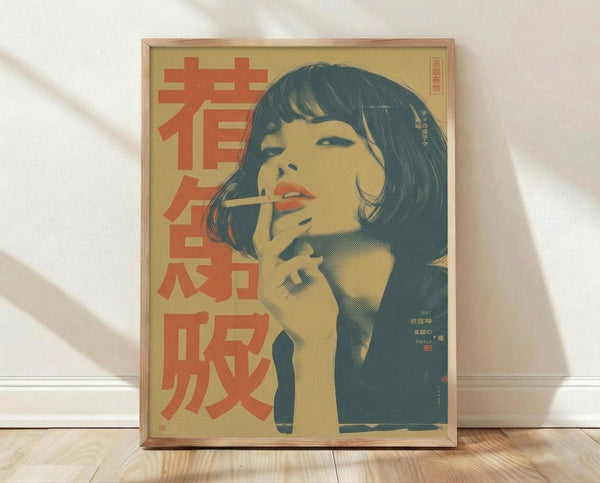May include: Framed vintage-style poster featuring a woman with dark bob haircut smoking a cigarette, rendered in muted yellow and teal tones with red Japanese text characters on left side. Wooden frame sits on light wood floor against white wall with soft natural lighting casting shadows.