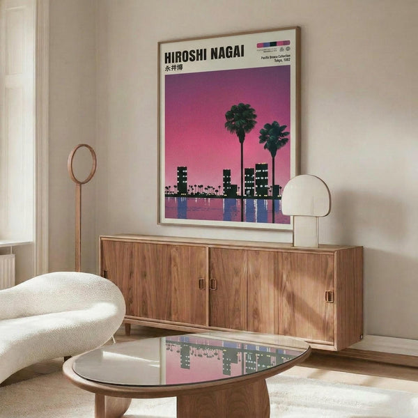 May include: Framed poster showing pink-purple sunset cityscape with palm trees and buildings reflected in water, displayed above mid-century modern walnut credenza in minimalist living room with white curved chair, brass floor lamp, white table lamp, and glass-top coffee table on light wood floors.