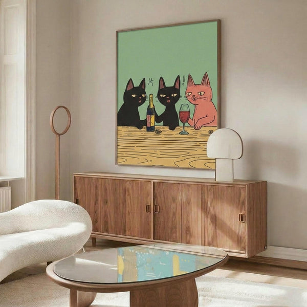May include: Whimsical poster print featuring three cartoon cats sharing wine at a wooden table against a mint green background, displayed in a thin brown frame above a mid-century modern walnut credenza in a bright living room with white curved chair, oval glass coffee table, and cream walls.