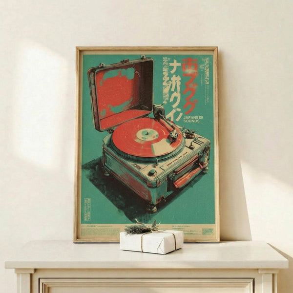 May include: Framed vintage-style poster with turquoise background featuring retro record player illustration in red and cream colors, displayed on light wood console table with small white wrapped gift, against white wall in minimalist room setting